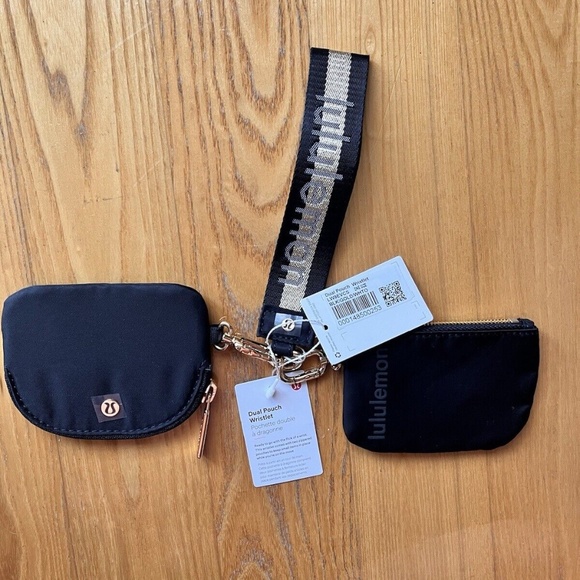 Brand new with tags Lululemon dual pouch keychain wristlet in black and gold - Picture 1 of 3
